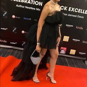 I am selling my beautiful Fashion Nova dress. Black half tutu design with train.